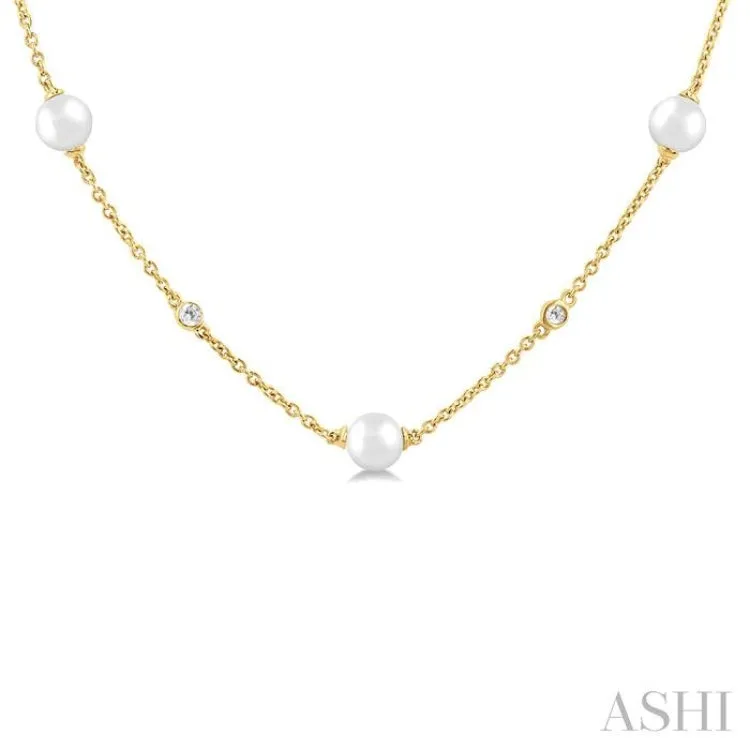 1/6 Ctw 4 MM Cultured Pearl and Round Cut Diamond Station Necklace in 14K Yellow Gold