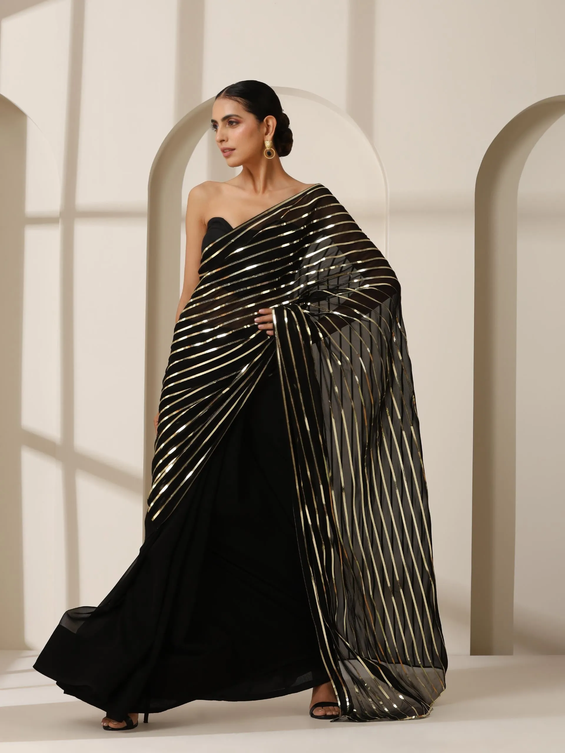 Black And Gold Impression Georgette Saree