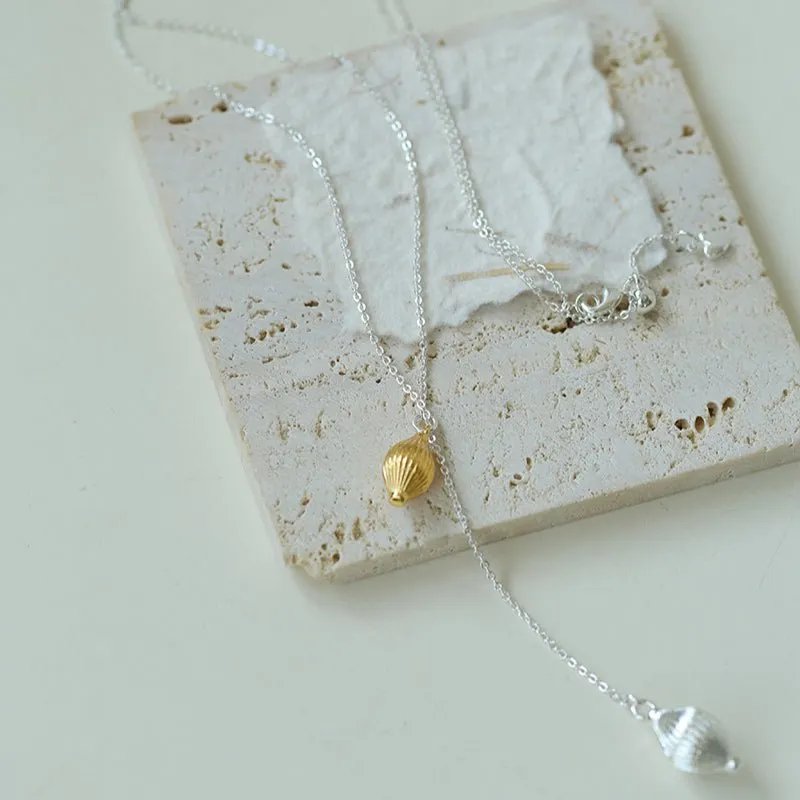 Long Gold and Silver Textured Seed Pendant Necklace