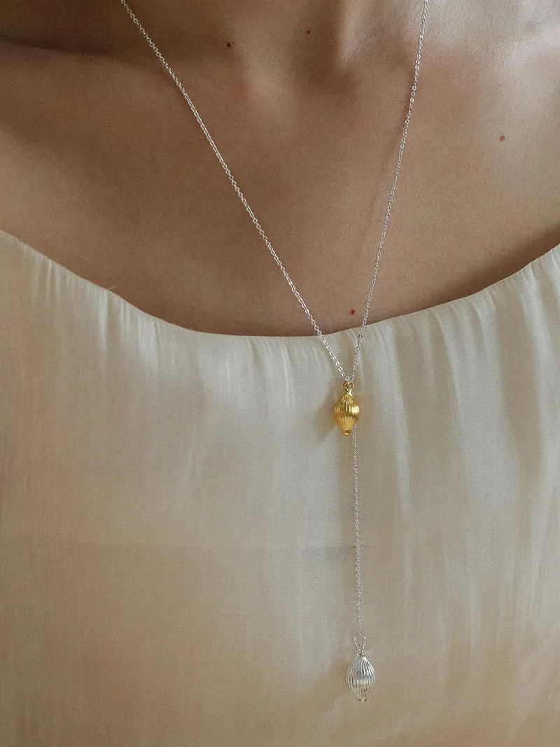 Long Gold and Silver Textured Seed Pendant Necklace