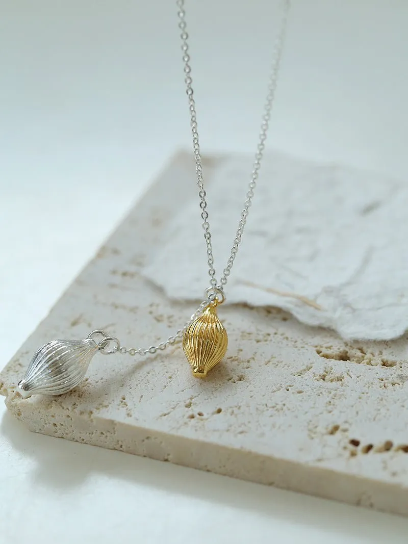 Long Gold and Silver Textured Seed Pendant Necklace